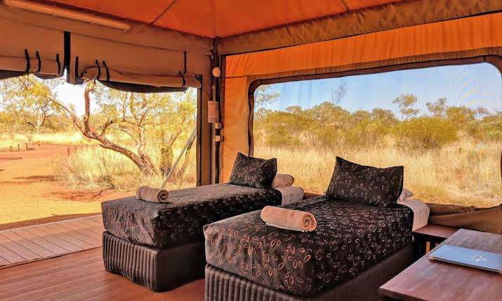 Two single beds inside an eco tent at Karijini Eco Retreat, from the Ladies HQ information pack
